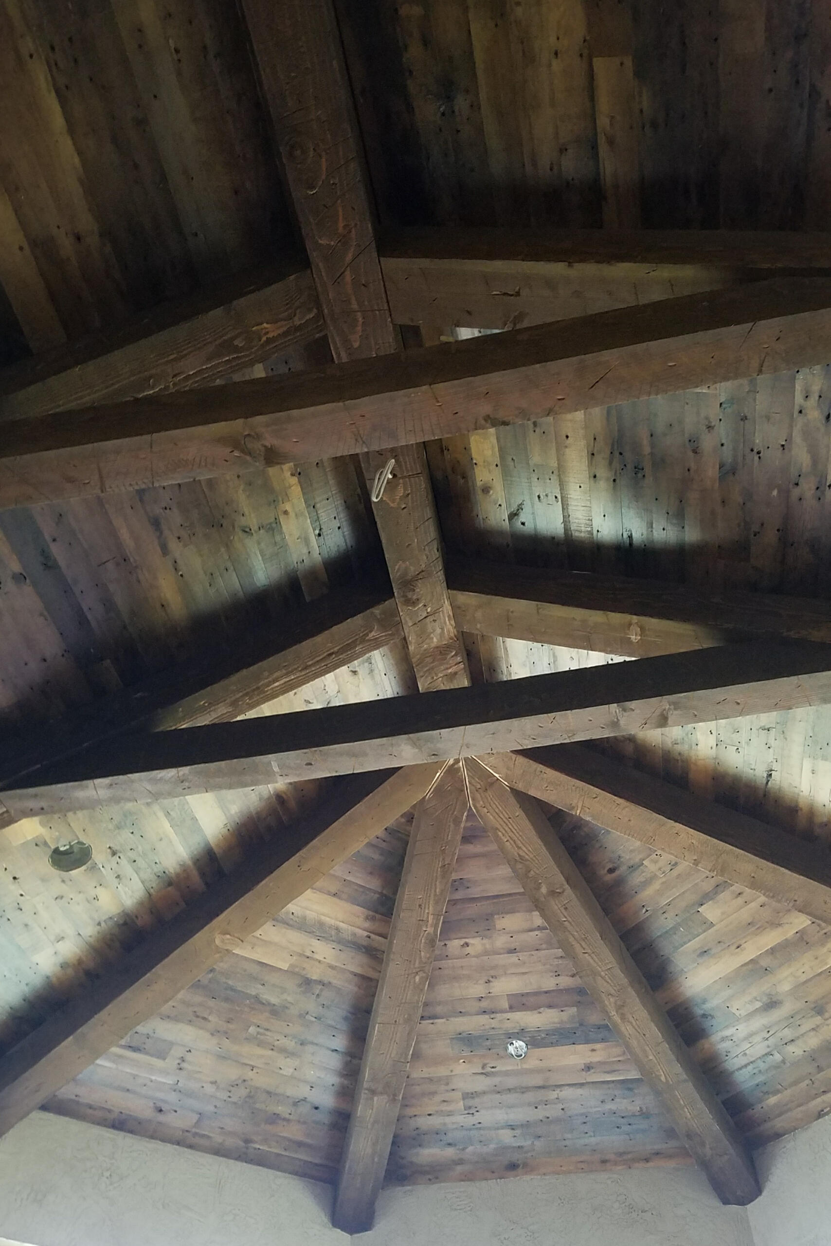 Custom-installed wood plank ceiling with natural finish and clean lines, designed and installed by TrueForm Interiors in a residential home near Springfield, Missouri. Adds warmth, texture, and architectural detail to the space.